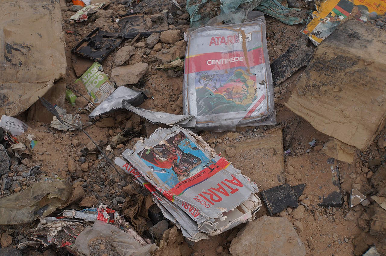Photo of a couple of old Atari 2600 game cartridges ("Centipede" and "E.T. The Extra-Terrestrial") in a New Mexico landfill. This burial was long thought to be an urban legend.