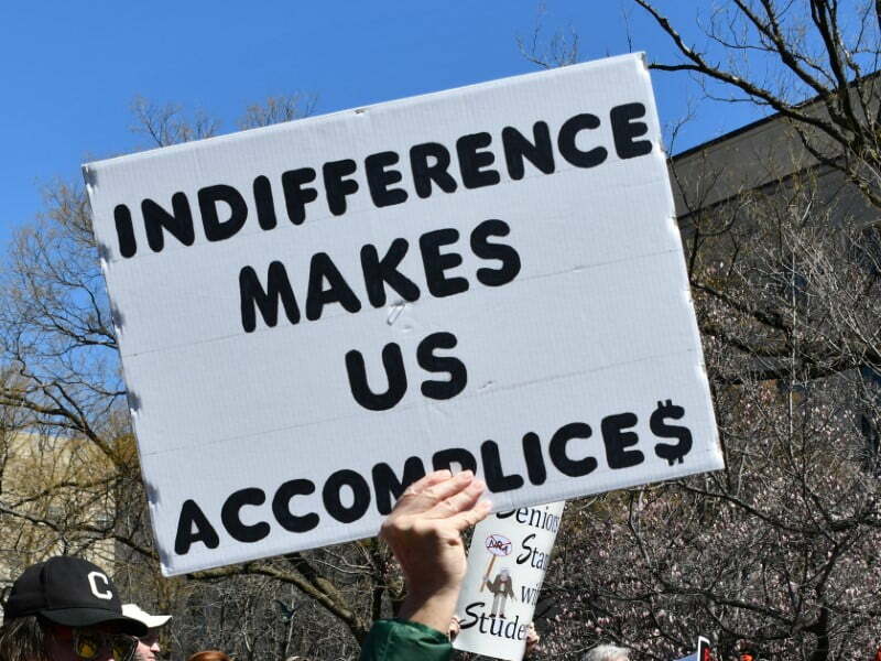 Sign "Indifference Makes Us Accomplices"