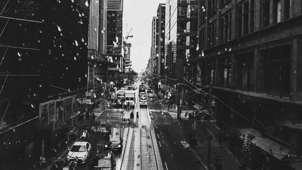 black and white picture of a busy street in city